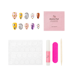 New Orleans medium almond press-on nails by 3H Nails, featuring jewel-tone gems, metallic stars, crystal accents, and reflective multicolor details, shown with the included application kit.