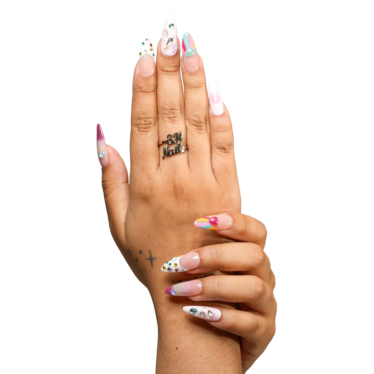 San Francisco medium almond press-on nails by 3H Nails, featuring pastel ombre color with hearts, stars, gems, metallic accents, and colorful French tips, shown on hands.