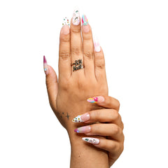 San Francisco medium almond press-on nails by 3H Nails, featuring pastel ombre color with hearts, stars, gems, metallic accents, and colorful French tips, shown on hands.
