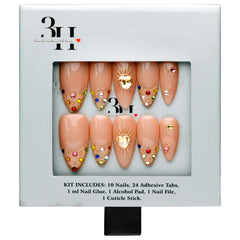 Boston medium almond press-on nails by 3H Nails, featuring a nude base with champagne glitter, multicolor gems, metallic accents, and heart details, displayed in 3H Nails packaging.