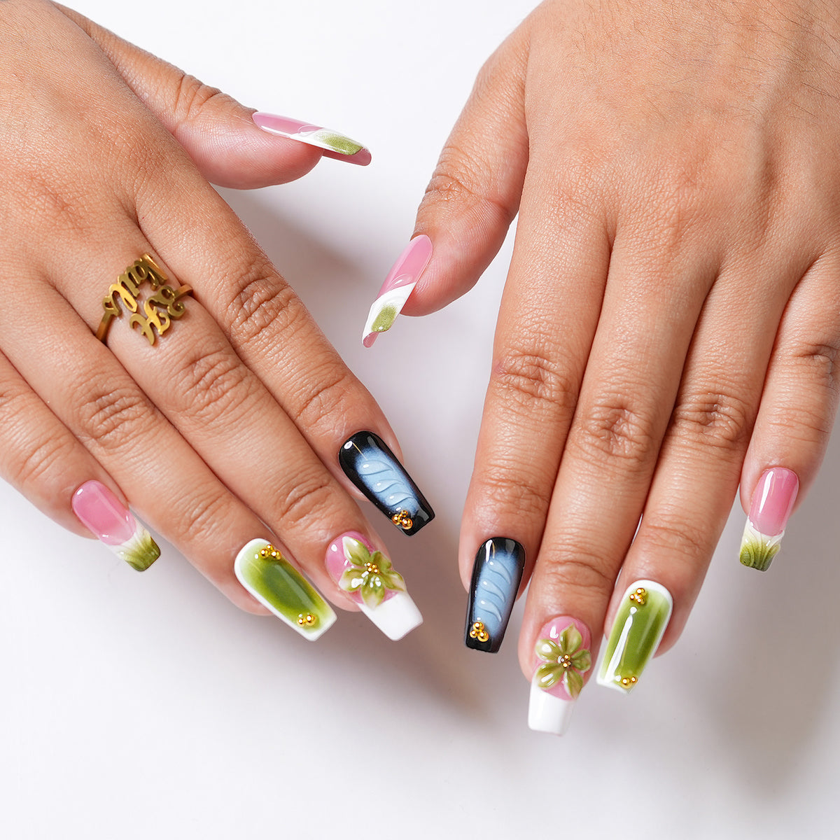 Orchid Dreams long square press-on nails worn on both hands, showing dimensional floral nail art and glossy mixed-color designs.
