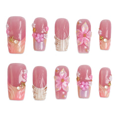 Set of Rosy Garden long square press-on nails by 3H Nails with a floral pink and green design, displayed on a white background.