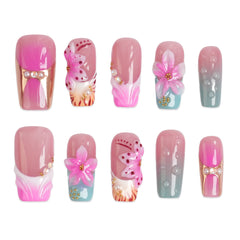 Long square press-on nails with tropical floral design from 3H Nails' Tropical Bloom collection, featuring vibrant, colorful flower patterns.