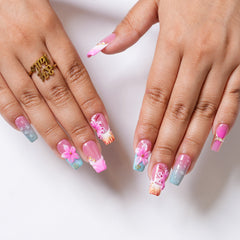 Long square press-on nails with tropical floral design by 3H Nails, showcasing vibrant, colorful tropical bloom patterns.