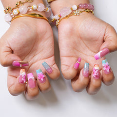 Long square press-on nails with tropical bloom floral design by 3H Nails, showcasing vibrant, colorful nail art.
