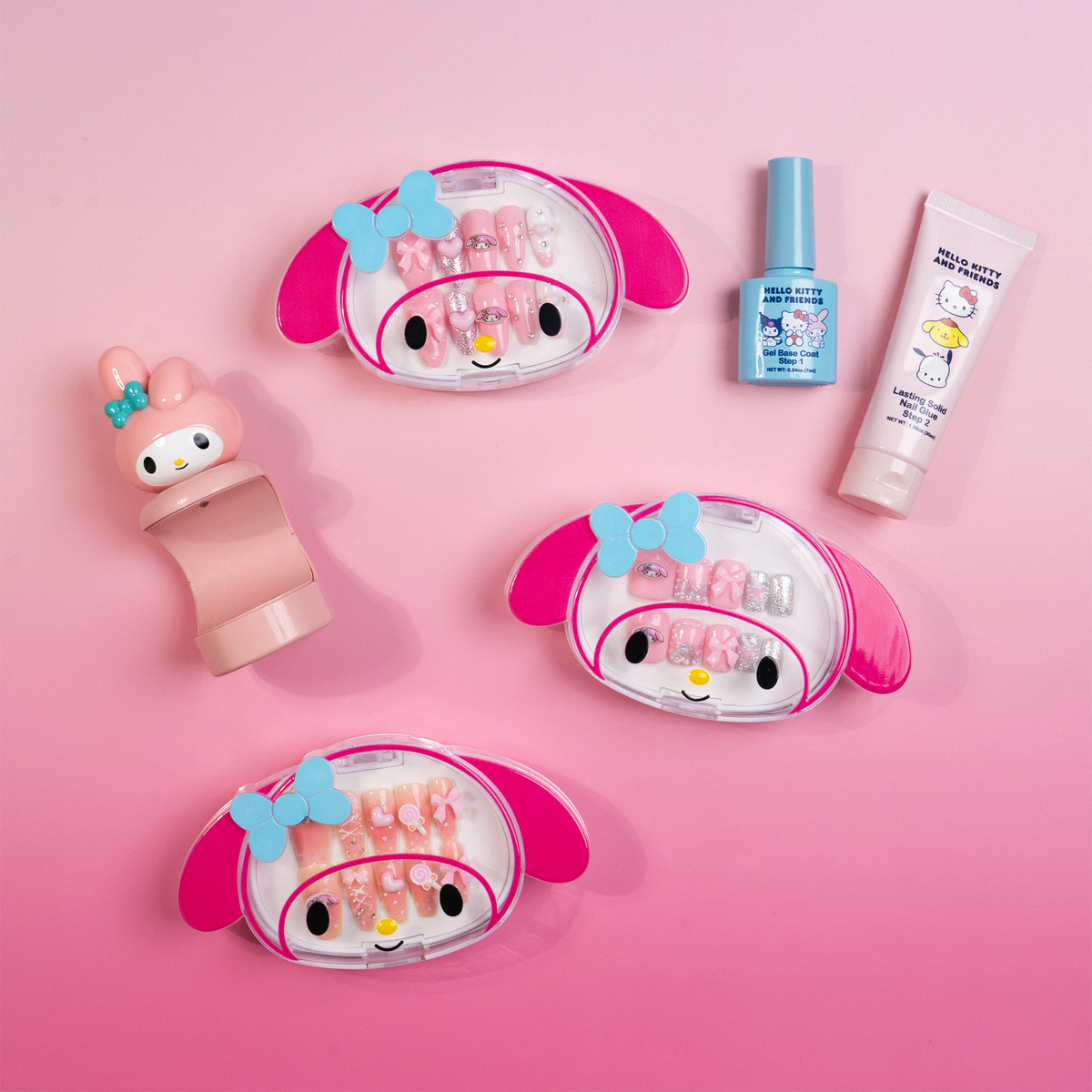 My Melody nail bundle arranged on a pink background with three press-on nail sets and application essentials